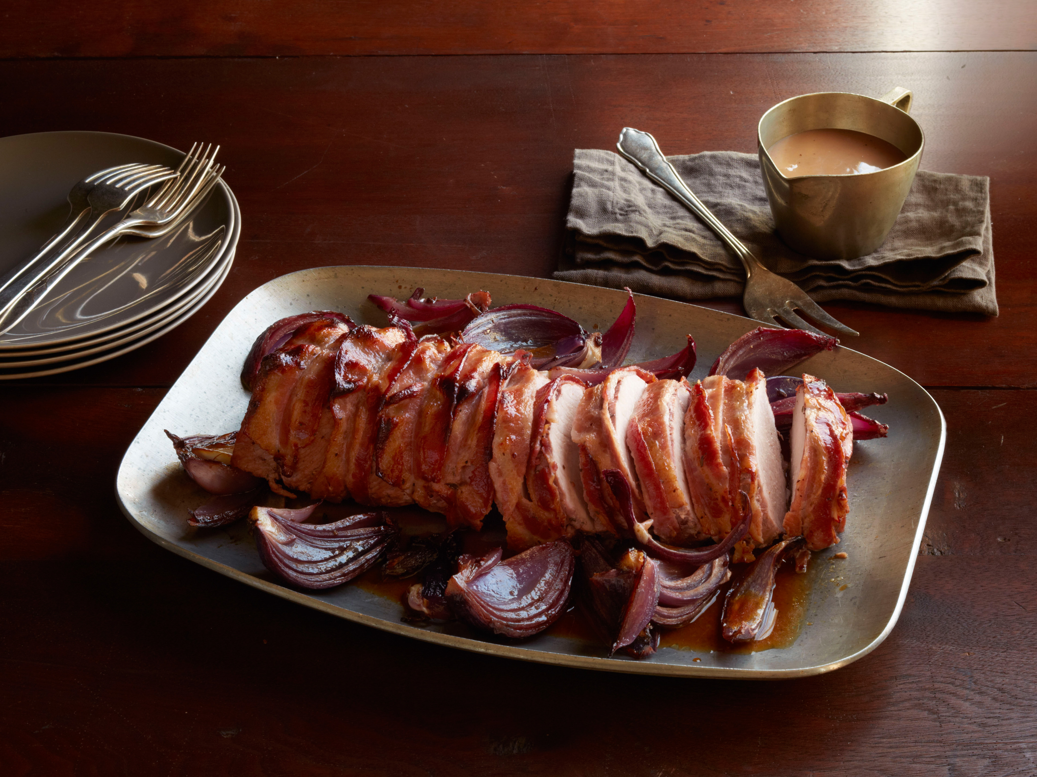 https://www.foodnetwork.com/content/dam/images/food/fullset/2014/2/7/1/FNM_030114-Bacon-Wrapped-Blackberry-Pork-Roast-Recipe_s4x3.jpg