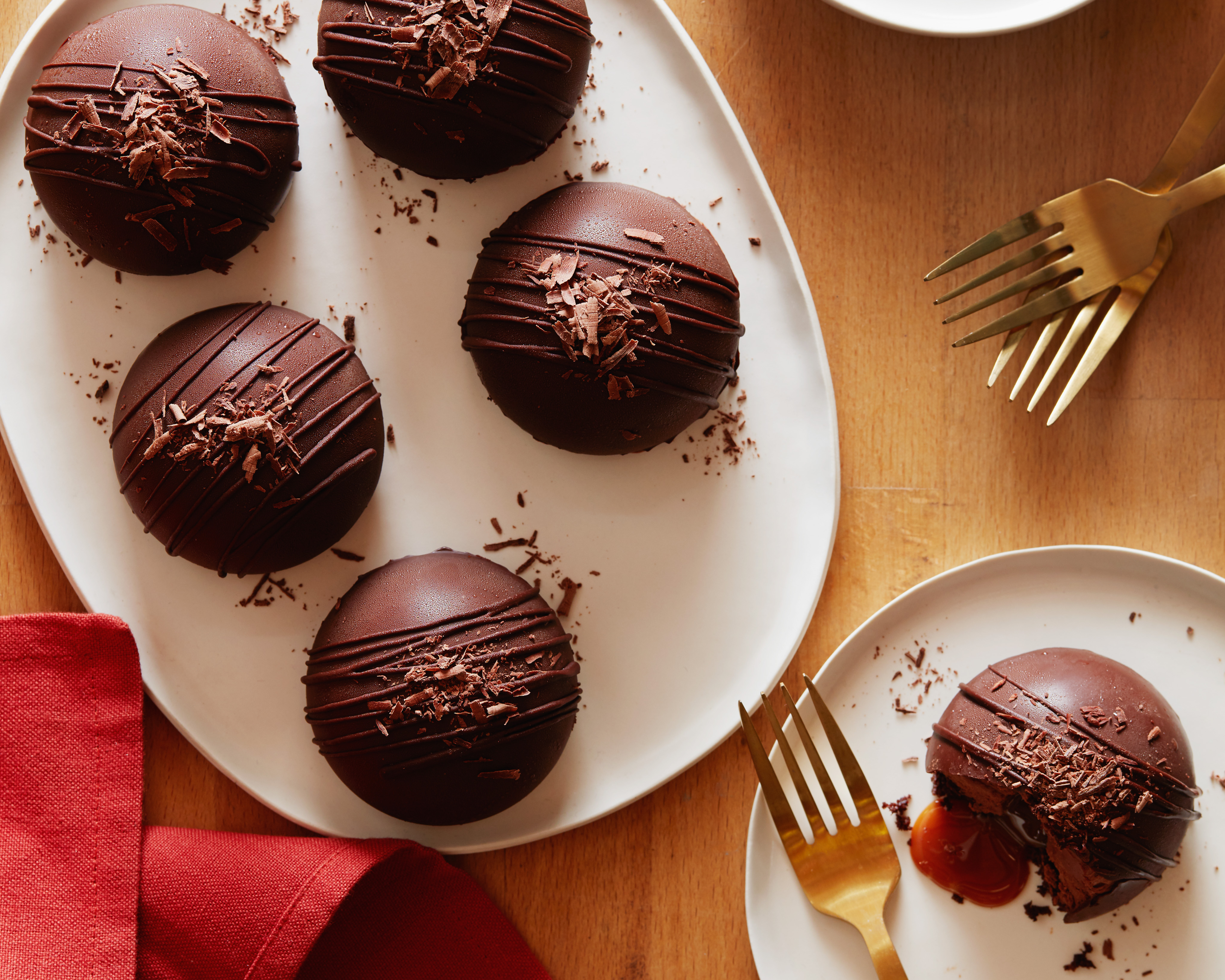 https://www.foodnetwork.com/content/dam/images/food/fullset/2018/7/30/0/FN_CHOCOLATE-CARAMEL-DOMES-OVERHEAD-SOLO-H_s4x3.jpg